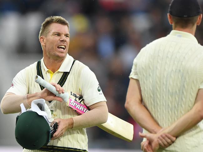 LEEDS, ENGLAND - AUGUST 22: Australia batsman David Warner has a word with England bowler Chris Woakes as players go off for bad light during day one of the 3rd Ashes Test match between England and Australia at Headingley on August 22, 2019 in Leeds, England. (Photo by Stu Forster/Getty Images)