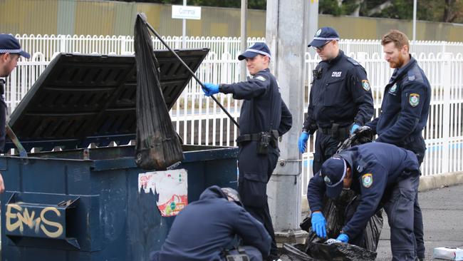 Police search Corrimal train station yesterday. Picture: John Grainger