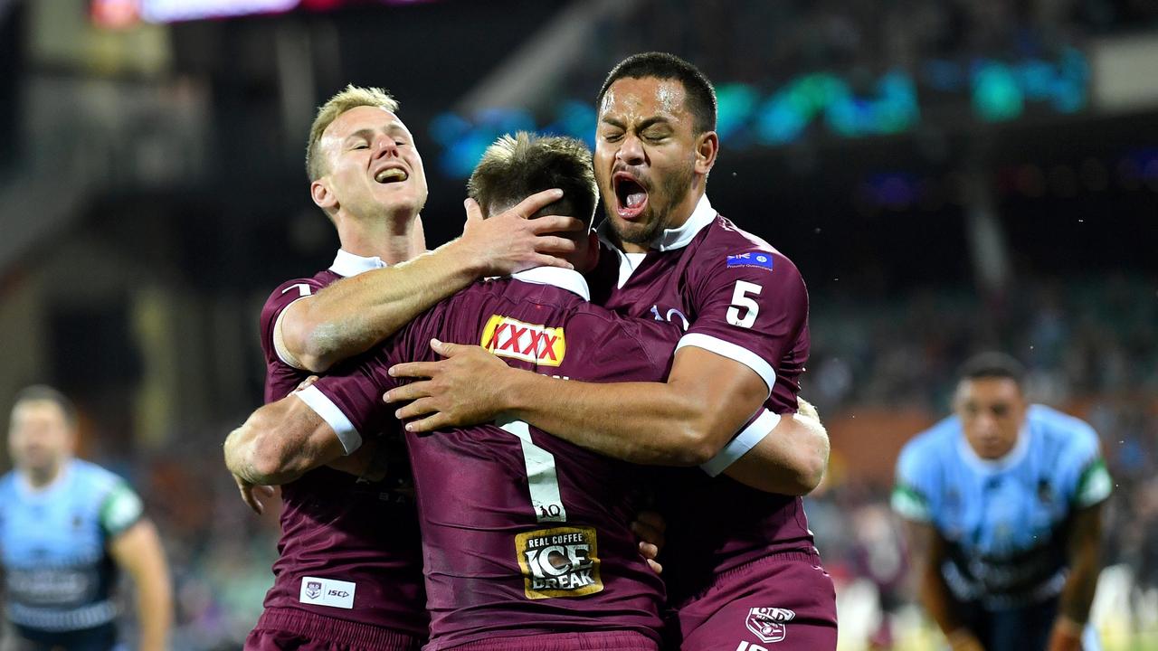 Phillip Sami and Daly Cherry-Evans celebrates with AJ Brimson after he scores