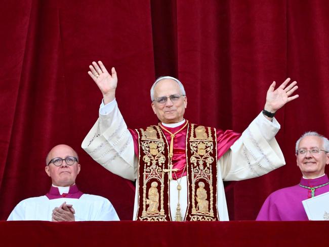 Newly elected Pope Leo XIV, Robert Prevost from the main central loggia balcony of the St Peter's Basilica for the first time, after the cardinals ended the conclave, in The Vatican, on May 8, 2025. Robert Francis Prevost was on Thursday elected the first pope from the United States, the Vatican announced. A moderate who was close to Pope Francis and spent years as a missionary in Peru, he becomes the Catholic Church's 267th pontiff, taking the papal name Leo XIV. (Photo by Alberto PIZZOLI / AFP)