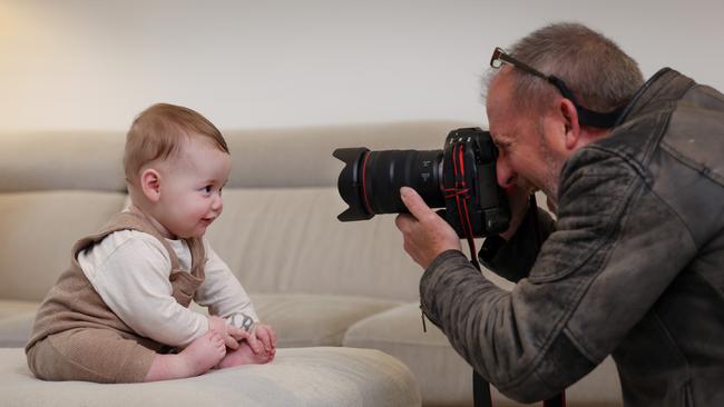 Herald Sun photographer David Caird, with six-month-old Archie, shares his top tips for photographing your baby. Picture: Craig Hughes