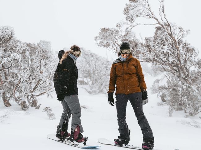 With Sydney locked down, snowboarders Siobhan Anton, 22, and Ellie McMaster, 19, from Newcastle, have the Perisher slopes all to themselves. Photo: Jamila Toderas