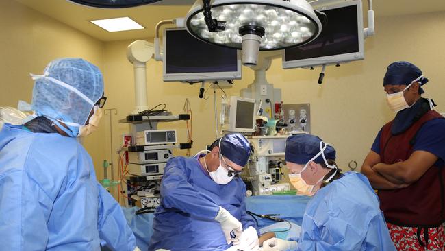 Dr Chris Jeffery assisting in the first operation of the world's smallest biomedical screw at Brisbane Private Hospital.