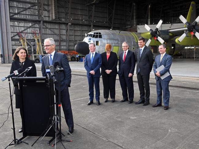 Prime Minister Malcolm Turnbull and Premier of New South Wales Gladys Berejiklian at Richmond RAAf base yesterday. Ms Berejiklian has become renowned as a tireless worker but a micromanager.