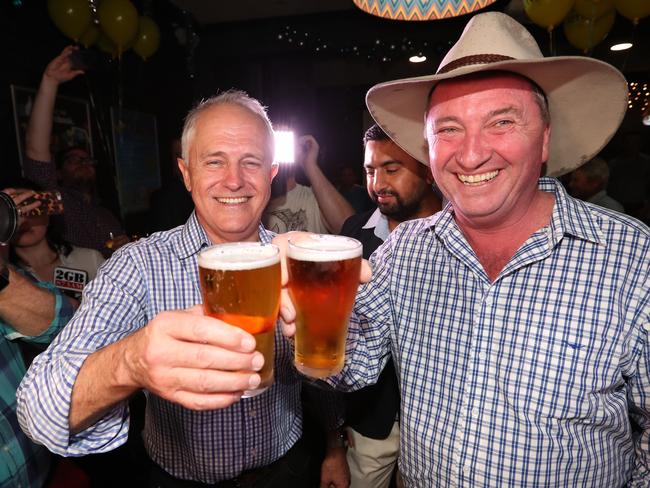 PM Malcolm Turnbull and Barnaby Joyce celebrates his win in the New England by-election with a beer. Picture: Lyndon Mechielsen/The Australian