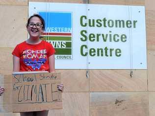 GO GREEN: Instead of enjoying her last day of the terms at her school's "Celebration Day", 12-year-old Ariel Ehlers from Chinchilla is taking a stand against climate change and protesting for climate action outside the Western Downs. Picture: Kate McCormack