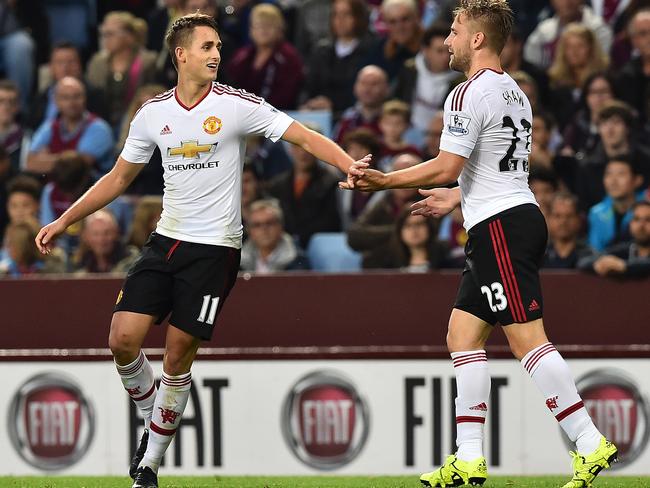 Manchester United's Belgian midfielder Adnan Januzaj (L) celebrates his goal.