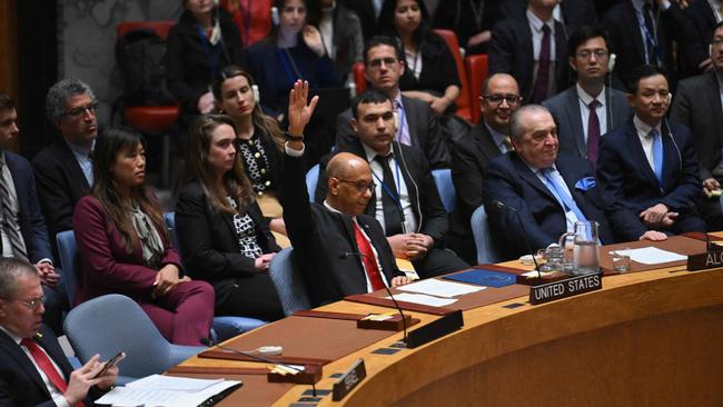 US Deputy Ambassador to the UN Robert Wood votes against a resolution allowing Palestinian UN membership at United Nations headquarters in New York, on April 18, 2024, during a United Nations Security Council meeting on the situation in the Middle East, including the Palestinian question. The United States vetoed a Security Council measure on a Palestinian bid for full United Nations membership. The draft resolution, which was introduced by Algeria and "recommends to the General Assembly that the State of Palestine be admitted to membership of the United Nations," received 12 votes in favor, two abstentions and one against. (Photo by ANGELA WEISS / AFP)