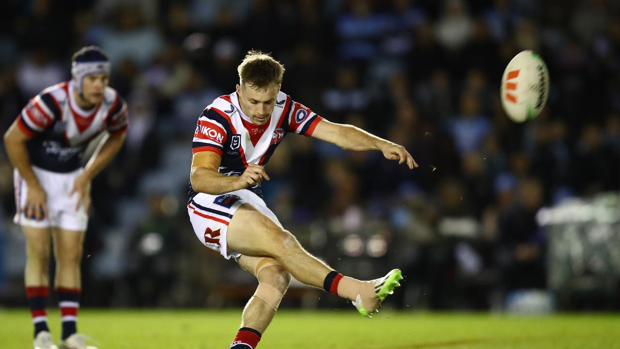 Clutch: Sam Walker nails a field goal to sink the Sharks. NRL Pics