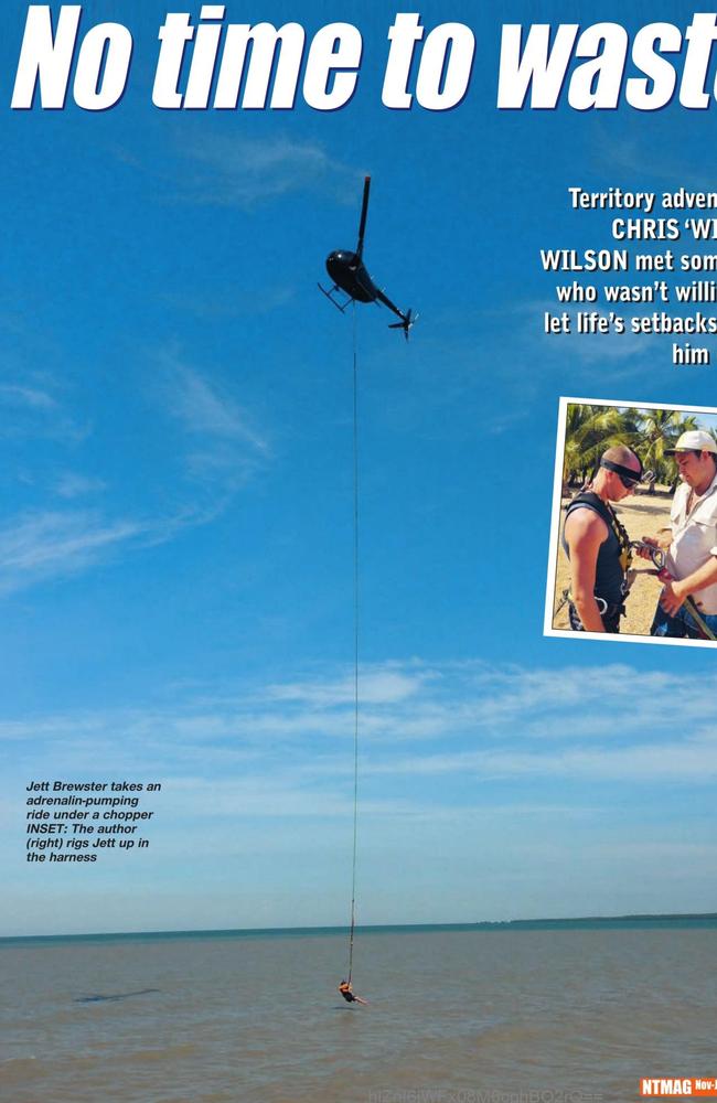 Jett Brewster dangling beneath a chopper related to Matt Wright's operations