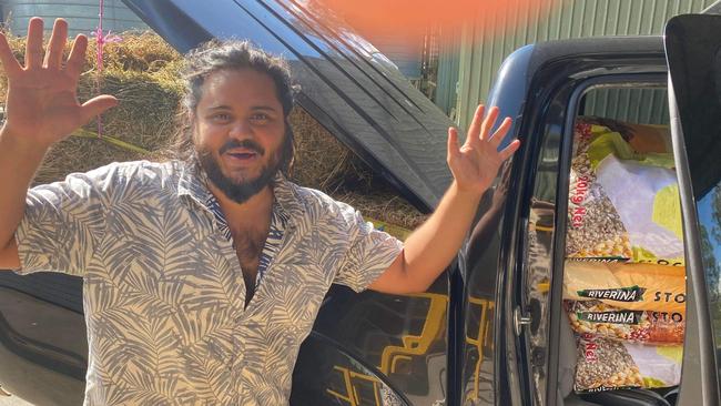 Tomas Cifuentes is helping deliver truck loads full of hay and feed to animals in need during the NSW Floods in 2022. Picture: Luka Tremback.