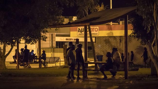 People on the streets after dark in Tennant Creek, Northern Territory.