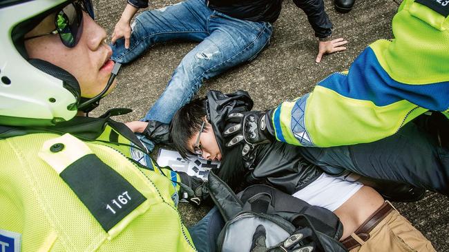 Wong detained by traffic police in Hong Kong in 2016. Picture: Handout/Getty Images