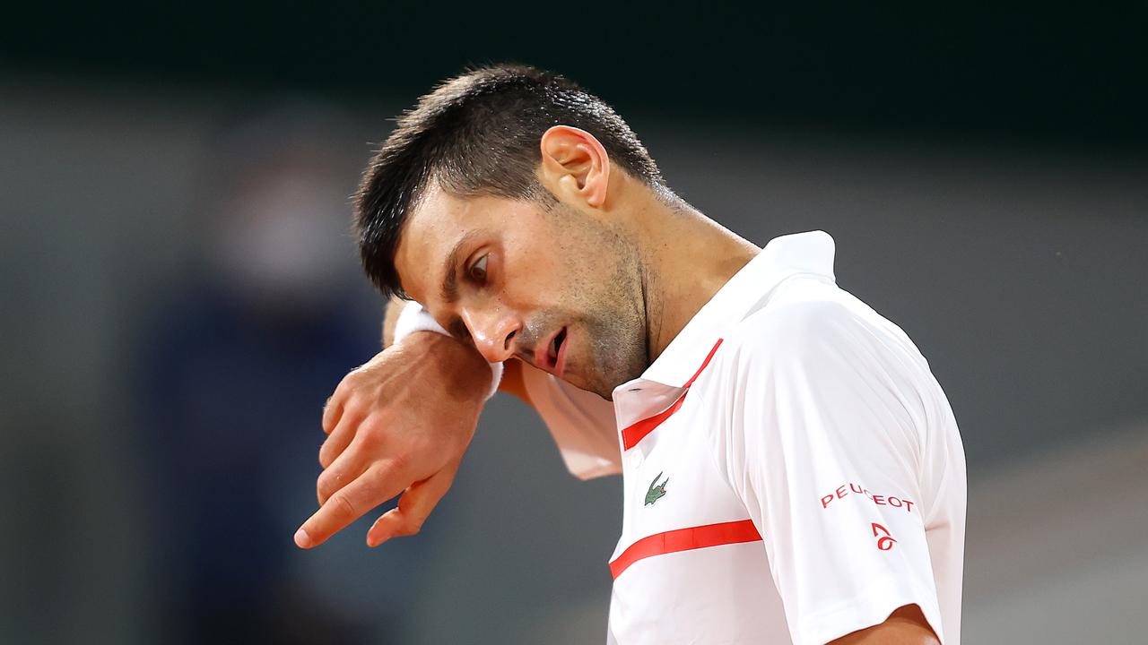 PARIS, FRANCE - SEPTEMBER 29: Novak Djokovic of Serbia wipes his face during his Men's Singles first round match against Mikael Ymer of Sweden on day three of the 2020 French Open at Roland Garros on September 29, 2020 in Paris, France. (Photo by Julian Finney/Getty Images)