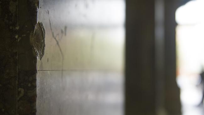 The only remaining evidence of a gunbattle which took place at Central Station in 1916 is a small bullet-hole in the marble by the entrance to platform one. Photos: Chris McKeen