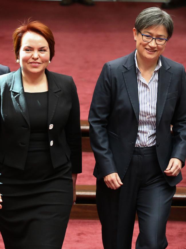 The late senator Kimberley Kitching (left) enters the chamber with Penny Wong in 2016. Picture: Ray Strange.