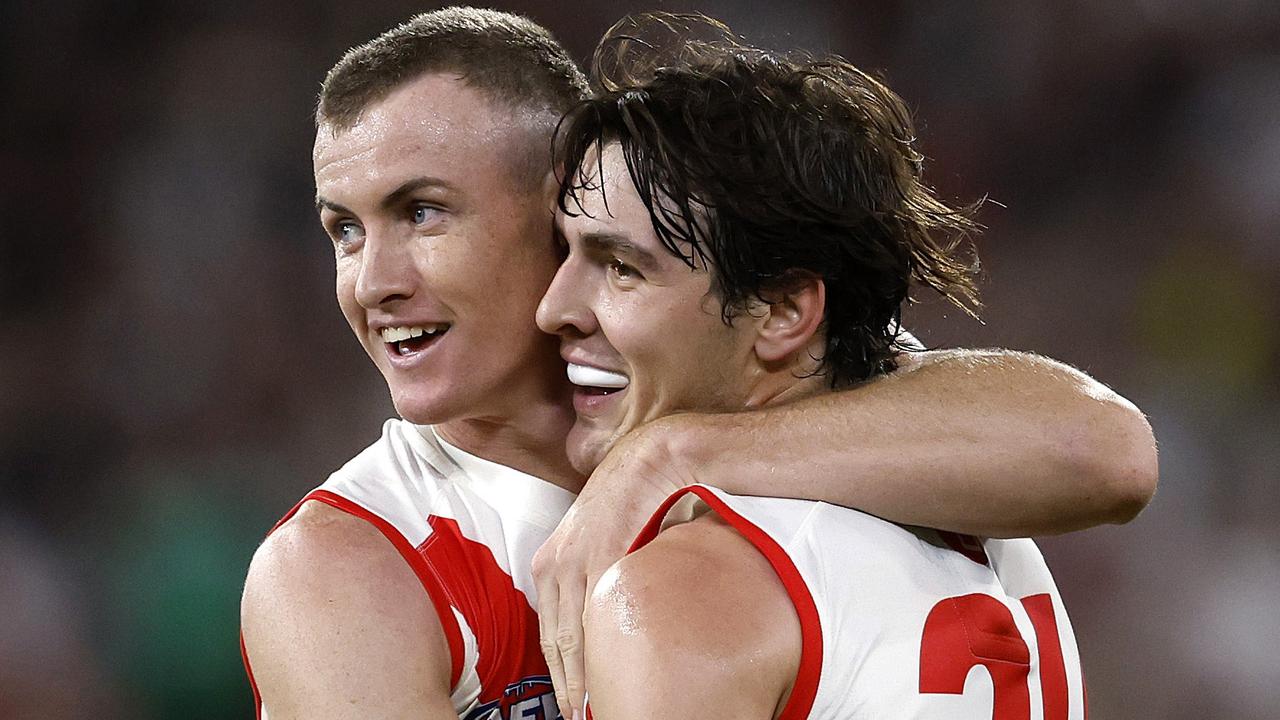 Sydney's Chad Warner and Errol Gulden celebrate setting up a goal to Logan McDonald during the Round 1 AFL match between the Collingwood Magpies and the Sydney Swans at the MCG on March 15, 2024. Photo by Phil Hillyard (Image Supplied for Editorial Use only - Phil Hillyard **NO ON SALES** - Â©Phil Hillyard )