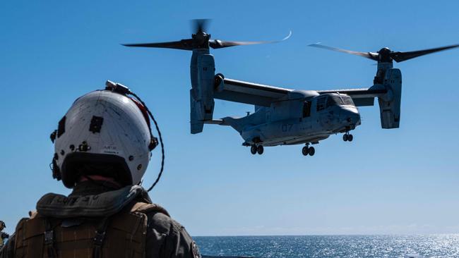 US Marine Corps Captain Andrew Johnson watches an MV-22B Osprey land on Royal Australian Navy ship HMAS Adelaide during Exercise Southern Jackaroo 23. Picture: Skyler M. Harris/ US Marine Corps