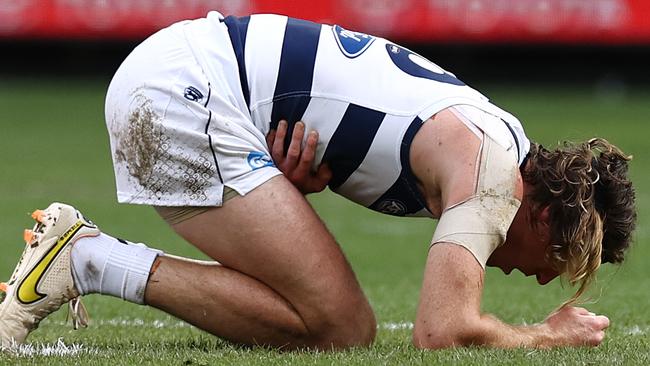 Mark Blicavs after copping a knee to the ribs from Lloyd Meek during a rucking contest. Picture: Michael Klein