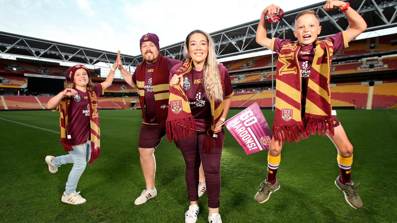 Gregg and Sophie Pearson with their kids Parker and Kaili walk onto Suncorp Stadium ahead of the State of Origin decider. Picture: Steve Pohlner