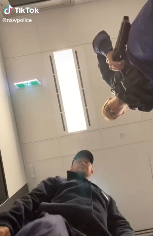 The video shows a police officer pulling on his hat before stomping on the camera.