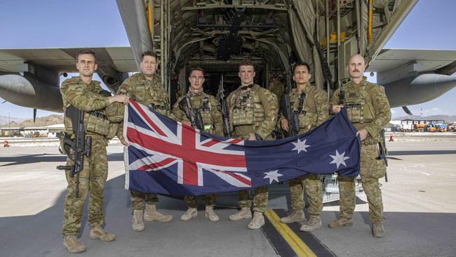 Australia has withdrawn its last remaining troops from Afghanistan ahead of September 11. Pictures are the last six remaining Australian troops with the Australian flag prior to boarding a RAAF C130 aircraft at the Hamid Karzai International Airport in Kabul, Afghanistan. They flew out for the last time on Friday, June 18 at 3.30pm local time. Picture: NCA NewsWire / Gary Ramage