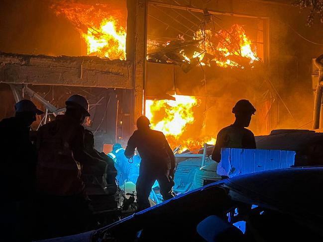 Lebanese emergency services battle a fire burns at the site of an Israeli strike that targeted a building in Beirut’s Mar Elias street. Picture: AFP