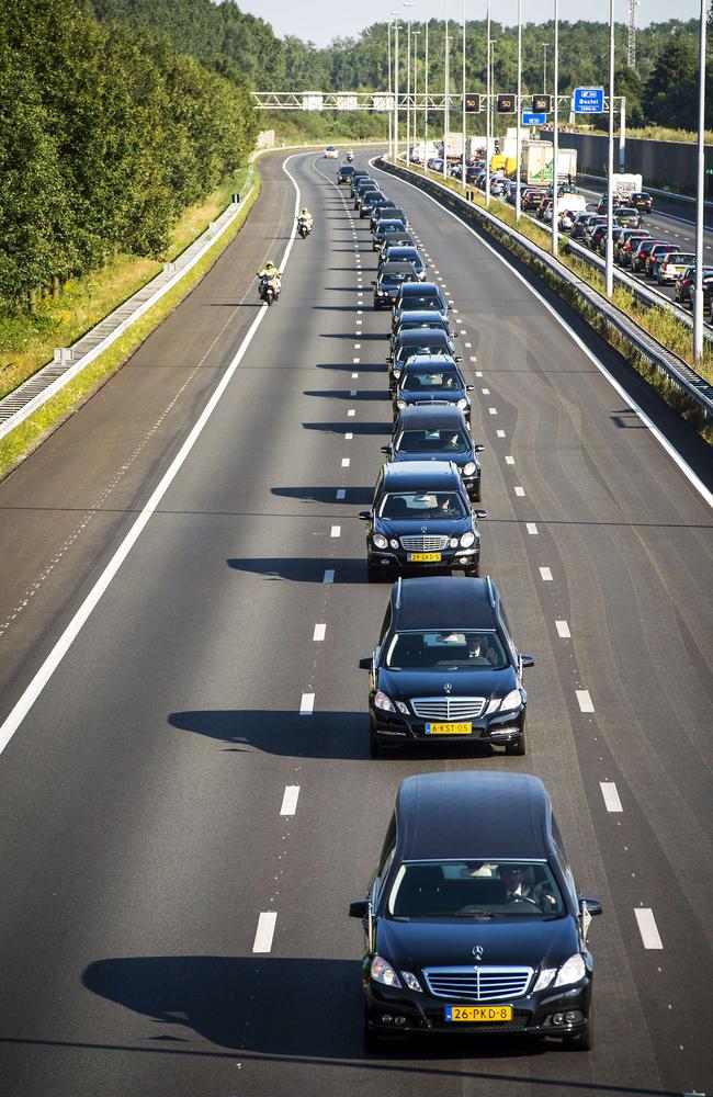 A convoy of hearses drives near Boxtel from the Eindhoven Airbase to Hilversum.