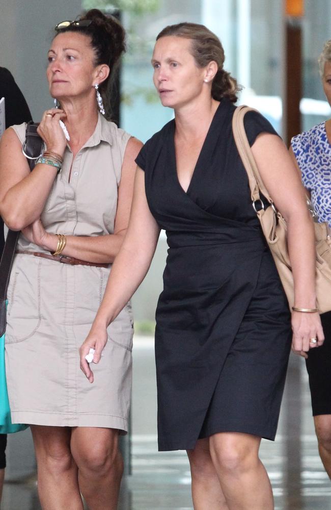 Kerri-Lee Karayan (right) leaves Brisbane District Court after the driver of a truck, David Gray, 52, was jailed for three years and three months for driving without due care, causing the death of her husband, cyclist Les Karayan.