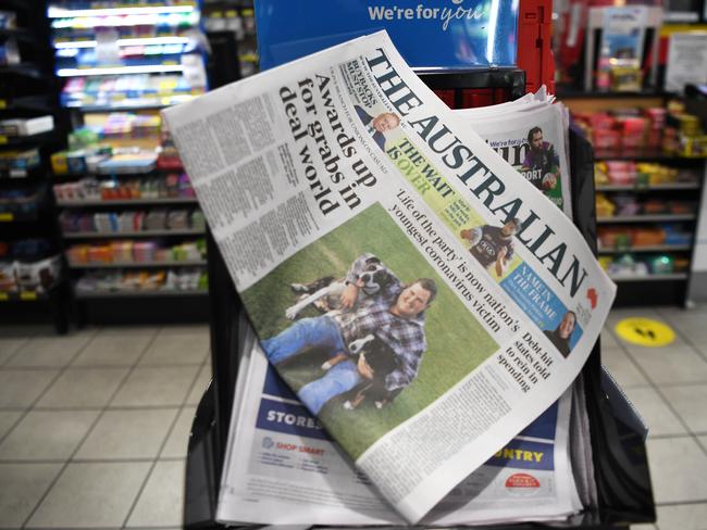 The Australian newspaper is seen on a newsstand in Melbourne, Thursday, May 28, 2020. News Corp Australia has announced the bulk of its regional and suburban community papers across the country will go digital only from June 29. (AAP Image/James Ross) NO ARCHIVING