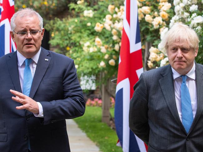 LONDON, ENGLAND - JUNE 15: UK Prime Minister Boris Johnson (R) and Australian Prime Minister Scott Morrison in the garden of 10 Downing Street, after agreeing the broad terms of a free trade deal between the UK and Australia, on June 15, 2021 in London, England. The leaders met as the two countries announced one of Britain's first post-Brexit trade deals. (Photo by Dominic Lipinski - WPA Pool/Getty Images)