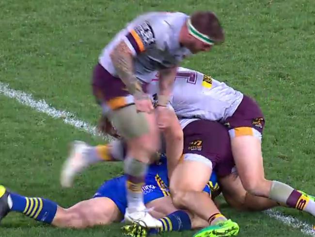 Josh McGuire treads on Tim Mannah's leg.