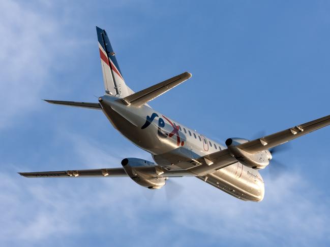 Adelaide, Australia - REX (Regional Express Airlines) Saab 340 twin engined regional commuter aircraft taking off from Adelaide Airport.Escape 15 October 2023Doc HolidayPhoto - iStock