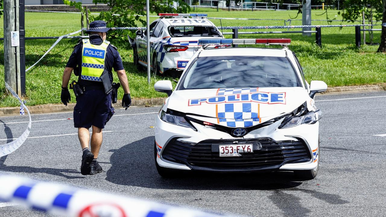 Police officers inspect a crime scene at the intersection of Sondrio and Torino Streets, Woree, where a 21-year-old male was allegedly shot by police officers after stealing a police car. Picture: Brendan Radke