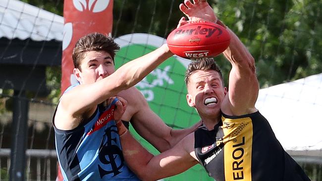 Sturt's Sam Wundke spoils Glenelg’s Jack Hannath. Picture: Sarah Reed