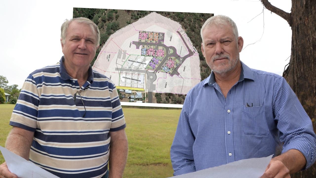 Crows Nest Community Solutions Ltd directors Jeff Close and Baden Brown survey the plans for a new community and affordable housing project at the end of Creek Street in Crows Nest, dubbed Chaseley Park.