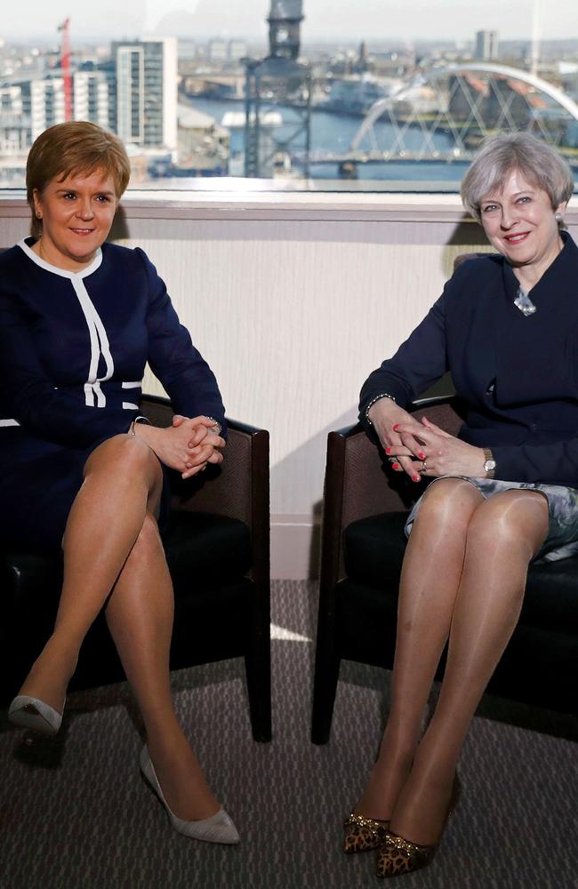 Britain's Prime Minister Theresa May (R) and Scotland's First Minister Nicola Sturgeon pose for a photograph ahead of their meeting in Glasgow.