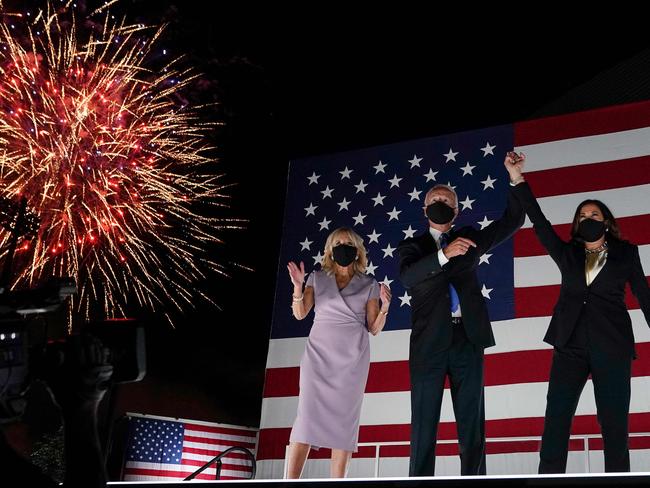 TOPSHOT - (From L) Jill Biden, husband former vice-president and Democratic presidential nominee Joe Biden and Senator from California and Democratic vice presidential nominee Kamala Harris greet supporters outside the Chase Center in Wilmington, Delaware, at the conclusion of the Democratic National Convention, held virtually amid the novel coronavirus pandemic, on August 20, 2020. (Photo by Olivier DOULIERY / AFP)