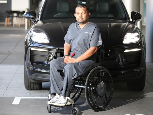 Dr Dinesh Palipana with his car. Picture: Glenn Hampson.