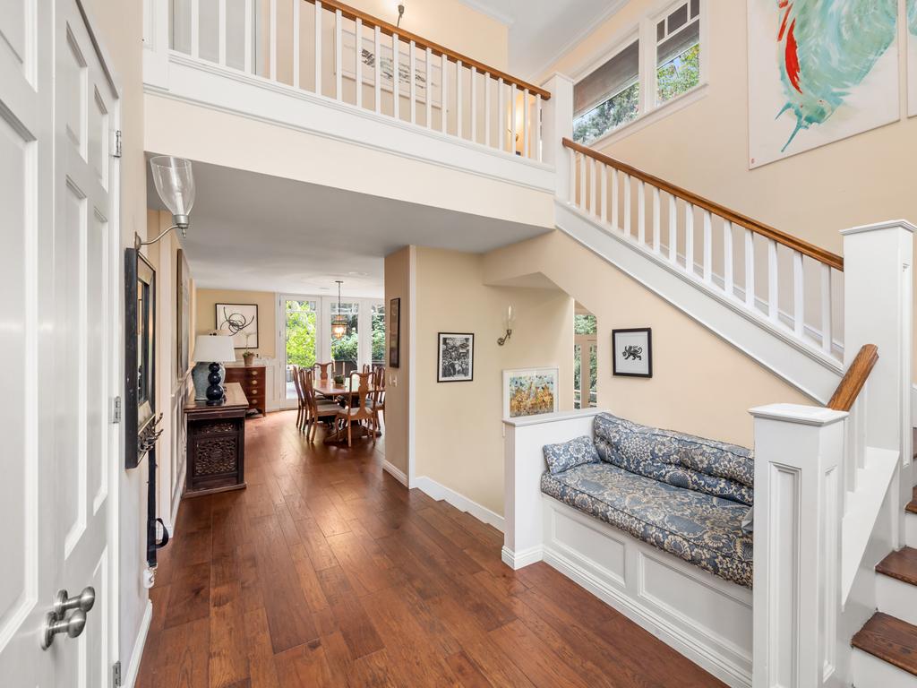 The traditional foyer shows off a curved staircase with overlook. Picture: Marc Angeles/TopTenRealEstateDeals
