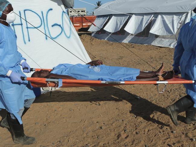 A woman diagnosed with cholera is carried away on a stretcher at a treatment centre in Beira, Mozambique, Saturday, March 30, 2019. Cholera cases among cyclone survivors in Mozambique have jumped to 271, authorities said, a figure that nearly doubled from the previous day. (AP Photo/Tsvangirayi Mukwazhi)