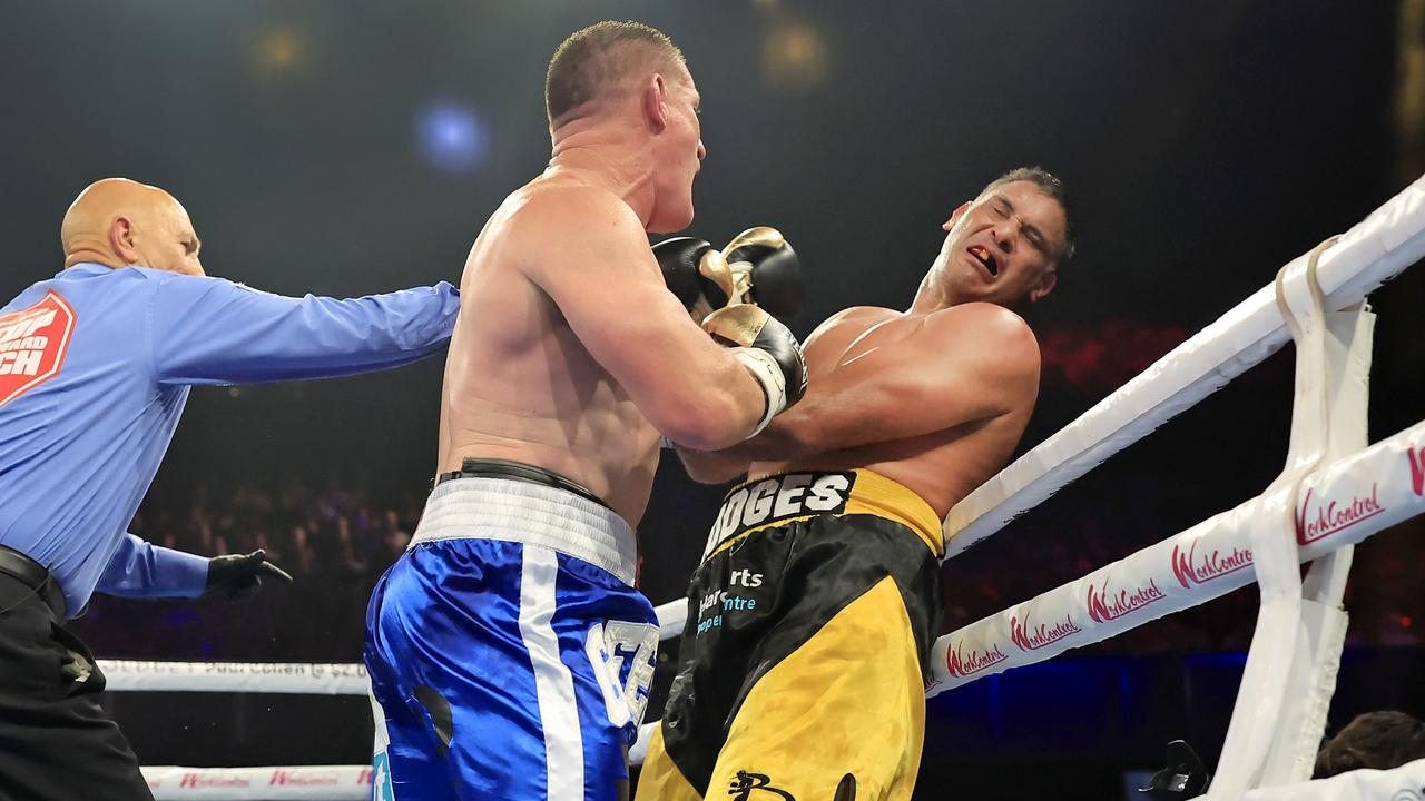 Paul Gallen throws a punch during the and Justin Hodges fight. The proposed Gallen-Aloiai fight would be on a similar NRL fight card. Photo: Getty Images