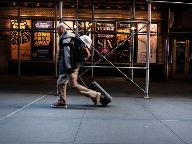 People walk through the empty Broadway theatre district one year after it was closed due to COVID restrictions in New York City. Picture: Getty Images/AFP