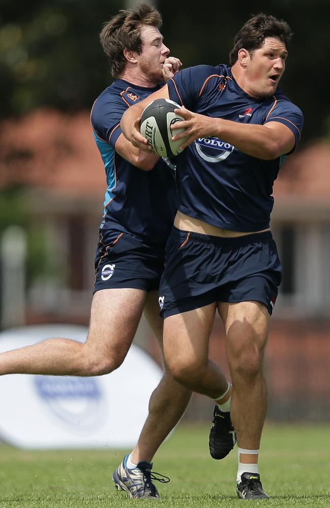 Jeremy Tilse is tackled during a Waratahs Super Rugby pre-season training session.