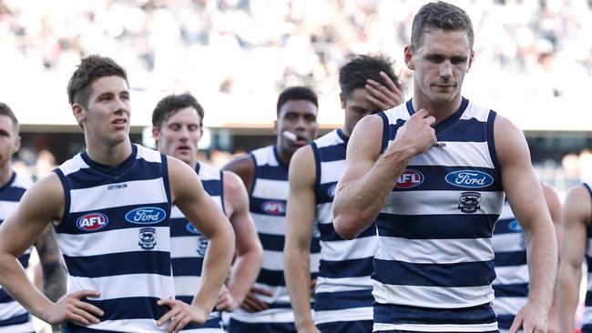 Disappointed Geelong players leave the ground on Sunday. Picture: Getty Images