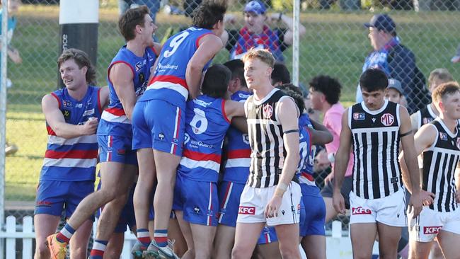 Bulldogs players celebrate after their come-from-behind win against Port Adelaide at Elizabeth Oval. Picture: David Mariuz/SANFL.