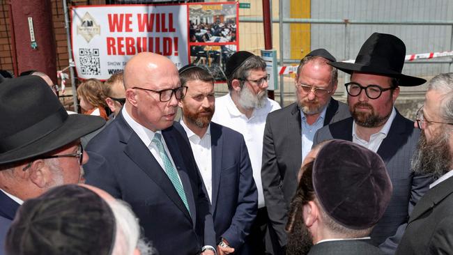 Mr Dutton speaks to members of the Jewish community outside the damaged Adass Israel Synagogue in the Melbourne suburb of Ripponlea. Picture: AFP