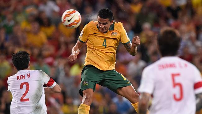 BRISBANE, AUSTRALIA - JANUARY 22: Tim Cahill of Australia heads the ball into the goal during the 2015 Asian Cup match between China PR and the Australian Socceroos at Suncorp Stadium on January 22, 2015 in Brisbane, Australia. (Photo by Matt Roberts/Getty Images)