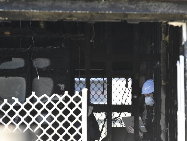 Investigators at the scene of a fatal house fire in Harristown, Wednesday, May 7, 2025. Picture: Kevin Farmer