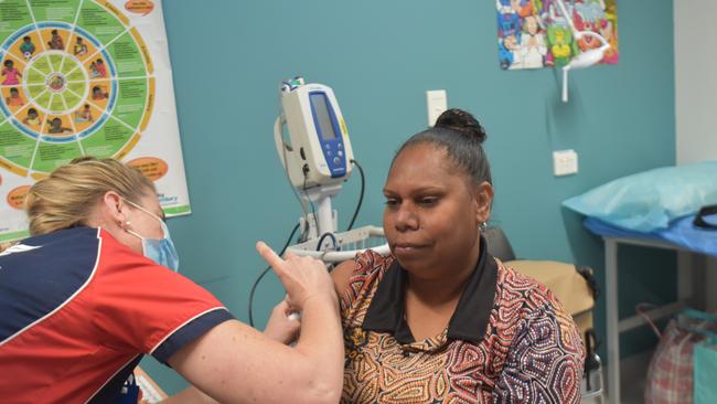 Sunrise Health's Michelle Farrell is given her first dose of the Pfizer Covid-19 vaccine by nurse Mandy Smallacombe. Picture: Thomas Morgan